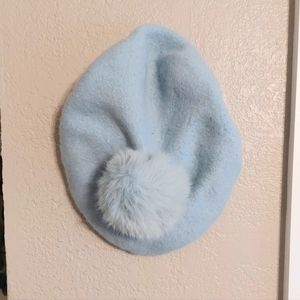 Beret hat with pom-pom on top, only worn once and is in perfect condition